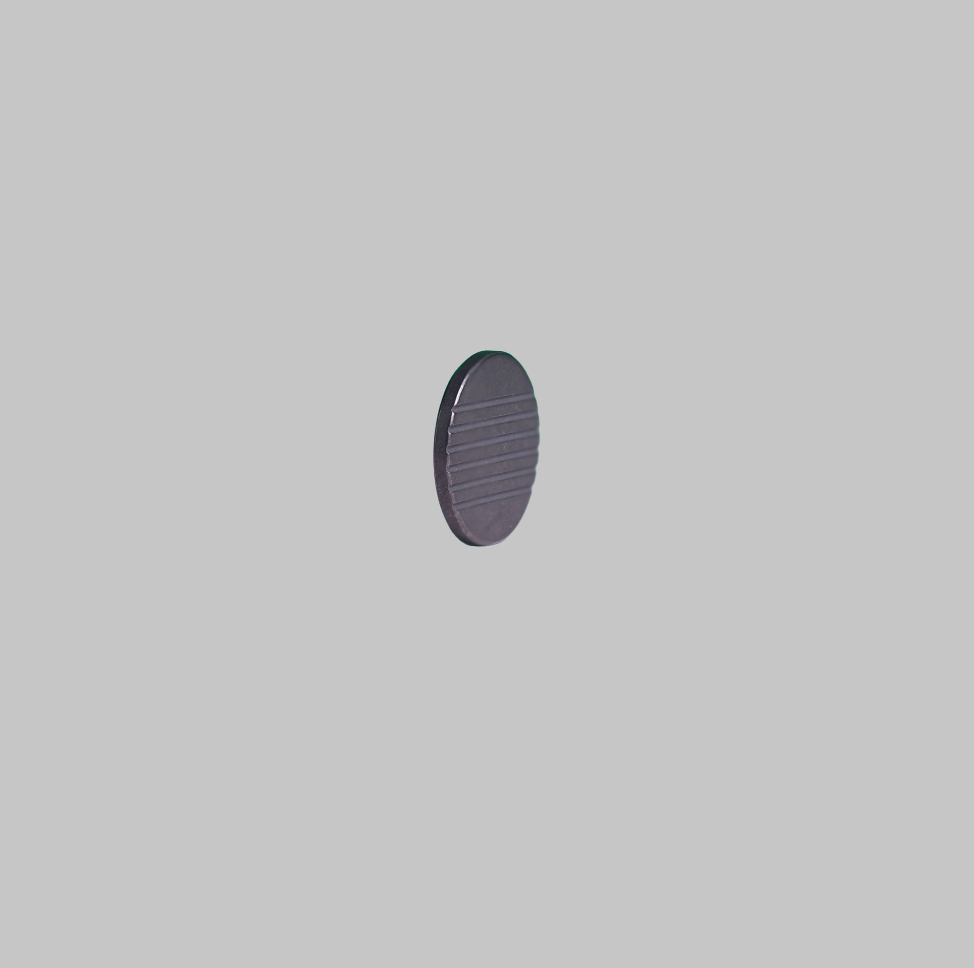 Ti MARKER titanium golf ball marker back angled view by Titan Golf
Tools