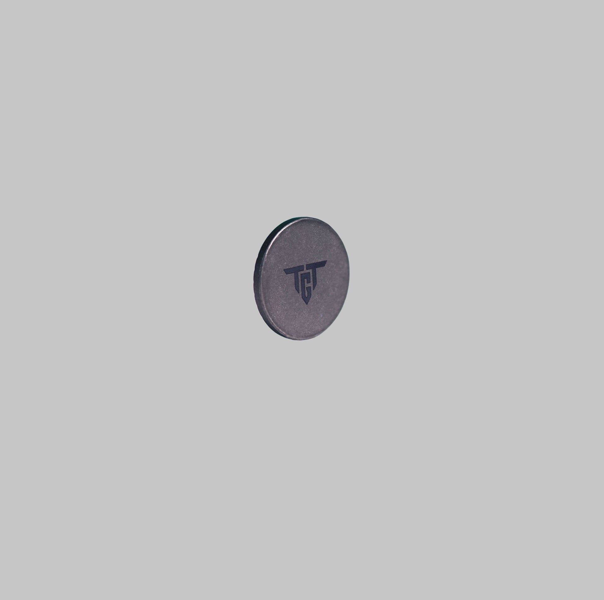 Ti MARKER titanium golf ball marker front angled view by Titan Golf
Tools
